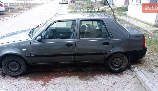 Сірий Дачія Solenza, об'ємом двигуна 1.4 л та пробігом 306 тис. км за 1300 $, фото 1 на Automoto.ua