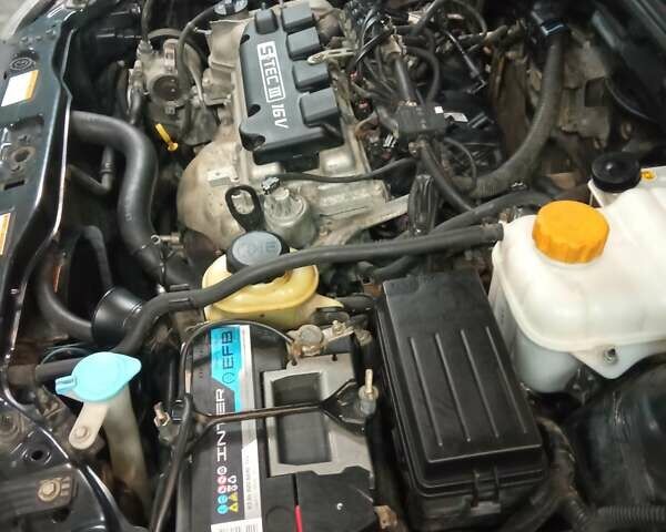 Черный Дэу Джентра, объемом двигателя 1.49 л и пробегом 122 тыс. км за 6750 $, фото 14 на Automoto.ua