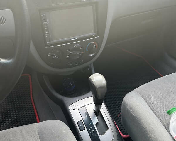 Червоний Деу Джентра, об'ємом двигуна 1.49 л та пробігом 192 тис. км за 6700 $, фото 7 на Automoto.ua