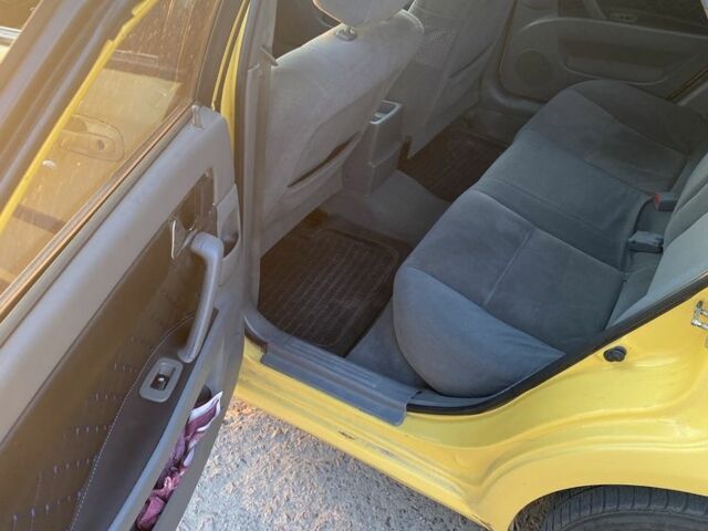 Желтый Дэу Джентра, объемом двигателя 1.5 л и пробегом 320 тыс. км за 2900 $, фото 2 на Automoto.ua