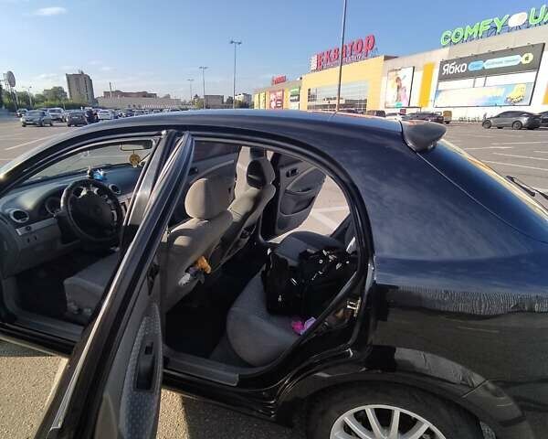 Черный Дэу Лачетти, объемом двигателя 1.8 л и пробегом 297 тыс. км за 4200 $, фото 9 на Automoto.ua