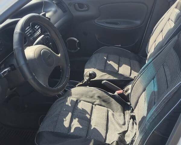 Білий Деу Ланос, об'ємом двигуна 1.5 л та пробігом 301 тис. км за 1750 $, фото 9 на Automoto.ua