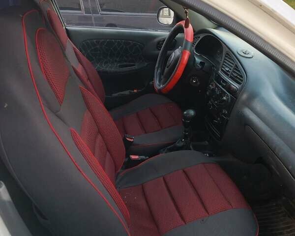 Белый Дэу Ланос, объемом двигателя 1.6 л и пробегом 250 тыс. км за 1300 $, фото 2 на Automoto.ua