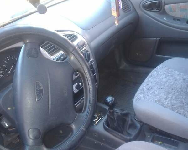 Белый Дэу Ланос, объемом двигателя 1.6 л и пробегом 220 тыс. км за 2200 $, фото 5 на Automoto.ua