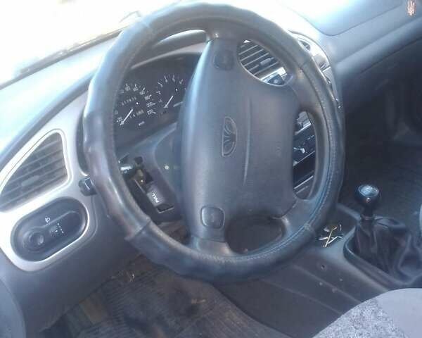 Белый Дэу Ланос, объемом двигателя 1.6 л и пробегом 220 тыс. км за 2200 $, фото 4 на Automoto.ua