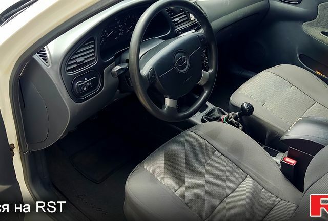 Білий Деу Ланос, об'ємом двигуна 1.5 л та пробігом 243 тис. км за 3150 $, фото 4 на Automoto.ua
