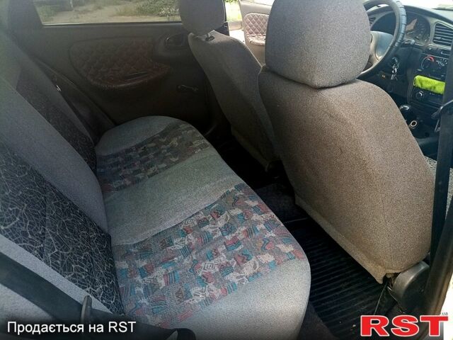 Белый Дэу Ланос, объемом двигателя 1.5 л и пробегом 257 тыс. км за 1750 $, фото 4 на Automoto.ua