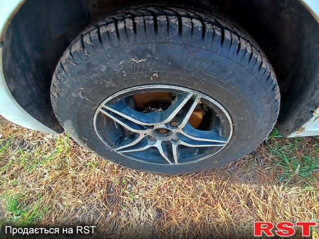 Білий Деу Ланос, об'ємом двигуна 1.4 л та пробігом 230 тис. км за 1250 $, фото 5 на Automoto.ua