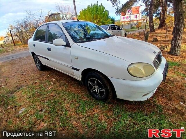 Белый Дэу Ланос, объемом двигателя 1.4 л и пробегом 230 тыс. км за 1250 $, фото 1 на Automoto.ua