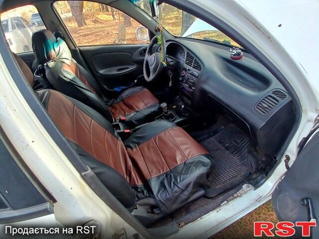 Білий Деу Ланос, об'ємом двигуна 1.4 л та пробігом 230 тис. км за 1250 $, фото 7 на Automoto.ua