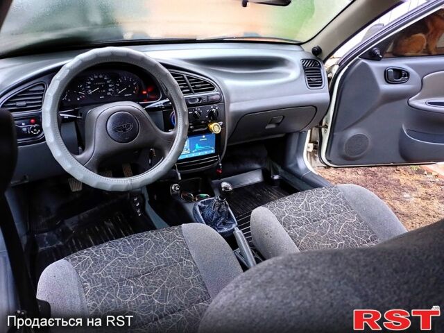 Белый Дэу Ланос, объемом двигателя 1.5 л и пробегом 230 тыс. км за 2750 $, фото 13 на Automoto.ua