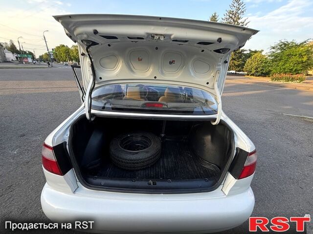 Белый Дэу Ланос, объемом двигателя 1.4 л и пробегом 150 тыс. км за 2000 $, фото 11 на Automoto.ua