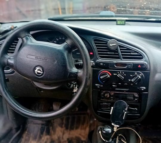 Белый Дэу Ланос, объемом двигателя 1.5 л и пробегом 150 тыс. км за 1400 $, фото 3 на Automoto.ua