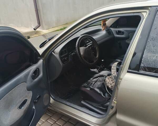 Бежевый Дэу Ланос, объемом двигателя 1.5 л и пробегом 286 тыс. км за 2100 $, фото 5 на Automoto.ua