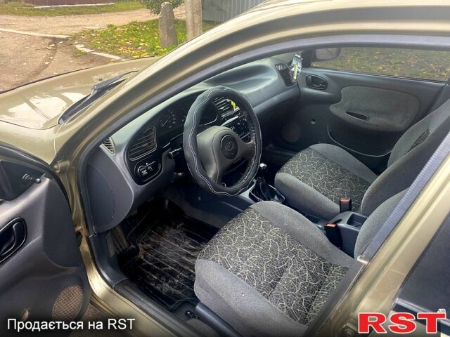 Бежевий Деу Ланос, об'ємом двигуна 1.5 л та пробігом 195 тис. км за 1999 $, фото 10 на Automoto.ua