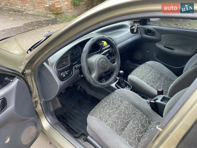 Бежевый Дэу Ланос, объемом двигателя 1.5 л и пробегом 195 тыс. км за 1899 $, фото 6 на Automoto.ua