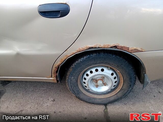 Бежевый Дэу Ланос, объемом двигателя 1.5 л и пробегом 208 тыс. км за 1300 $, фото 13 на Automoto.ua