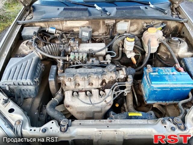 Бежевый Дэу Ланос, объемом двигателя 1.5 л и пробегом 208 тыс. км за 1300 $, фото 2 на Automoto.ua