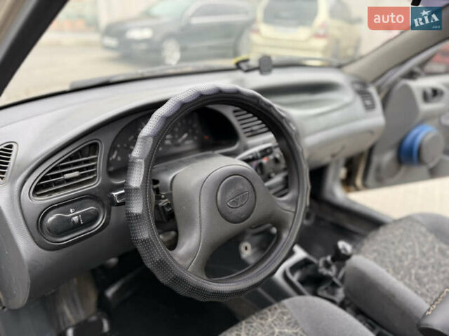Бежевий Деу Ланос, об'ємом двигуна 1.5 л та пробігом 224 тис. км за 2550 $, фото 14 на Automoto.ua