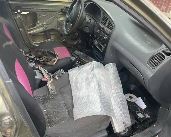 Бежевый Дэу Ланос, объемом двигателя 1.39 л и пробегом 226 тыс. км за 800 $, фото 15 на Automoto.ua