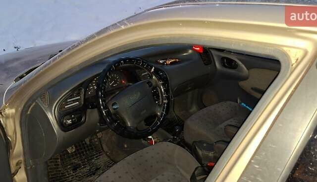 Бежевый Дэу Ланос, объемом двигателя 1.6 л и пробегом 290 тыс. км за 1800 $, фото 5 на Automoto.ua