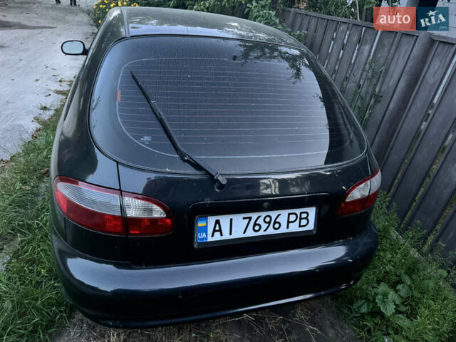 Чорний Деу Ланос, об'ємом двигуна 1.5 л та пробігом 280 тис. км за 1900 $, фото 3 на Automoto.ua