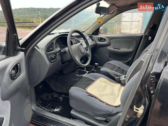 Чорний Деу Ланос, об'ємом двигуна 1.5 л та пробігом 189 тис. км за 1450 $, фото 13 на Automoto.ua