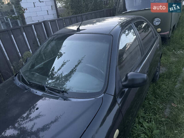 Чорний Деу Ланос, об'ємом двигуна 1.5 л та пробігом 280 тис. км за 1900 $, фото 2 на Automoto.ua