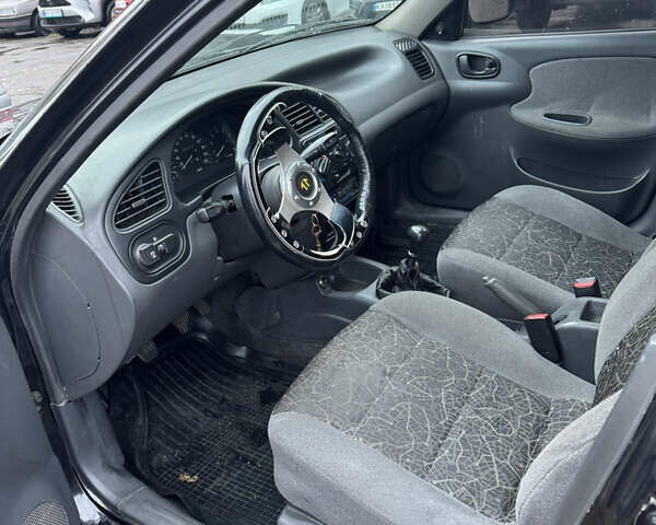 Черный Дэу Ланос, объемом двигателя 1.5 л и пробегом 350 тыс. км за 2450 $, фото 9 на Automoto.ua