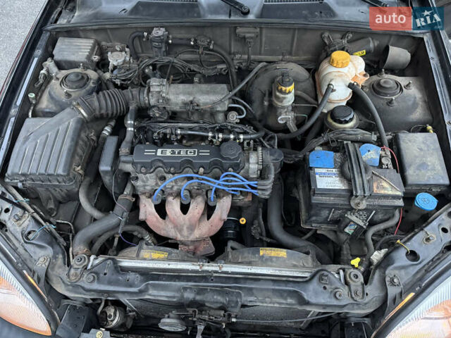 Черный Дэу Ланос, объемом двигателя 1.5 л и пробегом 350 тыс. км за 2450 $, фото 8 на Automoto.ua