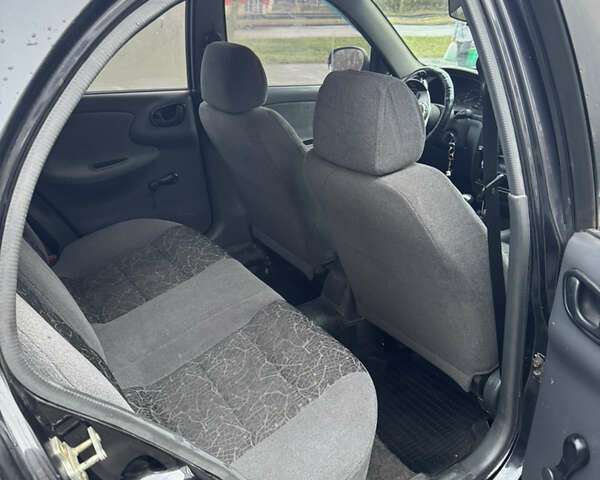 Черный Дэу Ланос, объемом двигателя 1.5 л и пробегом 350 тыс. км за 2450 $, фото 11 на Automoto.ua