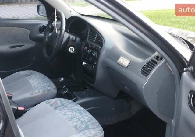 Черный Дэу Ланос, объемом двигателя 1.5 л и пробегом 145 тыс. км за 1950 $, фото 10 на Automoto.ua