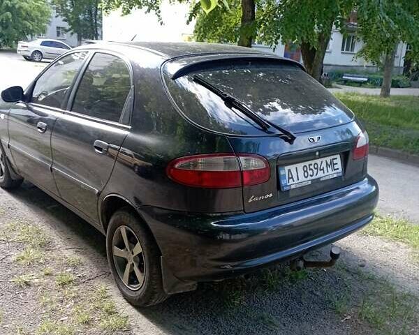 Черный Дэу Ланос, объемом двигателя 1.5 л и пробегом 153 тыс. км за 2100 $, фото 2 на Automoto.ua