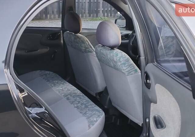 Черный Дэу Ланос, объемом двигателя 1.5 л и пробегом 145 тыс. км за 1950 $, фото 9 на Automoto.ua