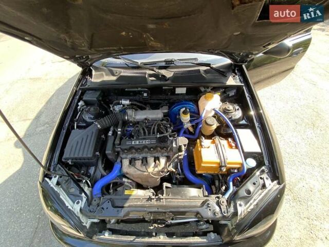 Черный Дэу Ланос, объемом двигателя 1.5 л и пробегом 218 тыс. км за 3400 $, фото 4 на Automoto.ua