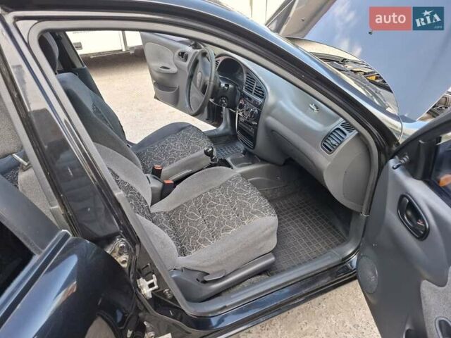 Черный Дэу Ланос, объемом двигателя 1.5 л и пробегом 234 тыс. км за 2900 $, фото 27 на Automoto.ua