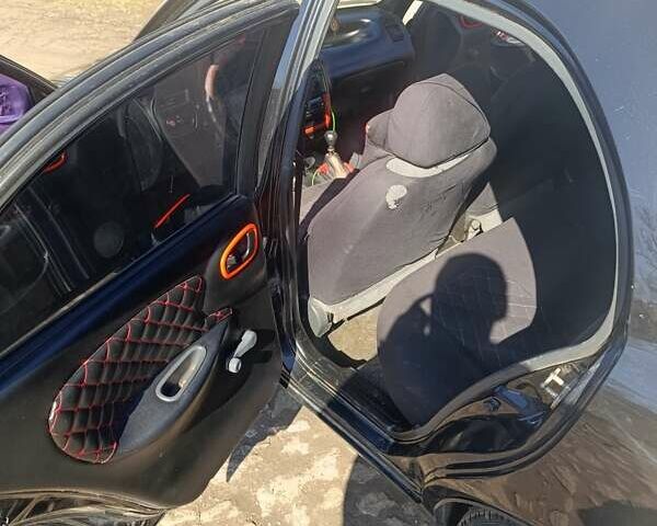 Чорний Деу Ланос, об'ємом двигуна 1.5 л та пробігом 214 тис. км за 2900 $, фото 5 на Automoto.ua