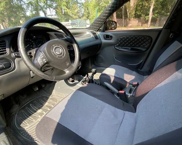 Черный Дэу Ланос, объемом двигателя 1.5 л и пробегом 218 тыс. км за 3400 $, фото 2 на Automoto.ua