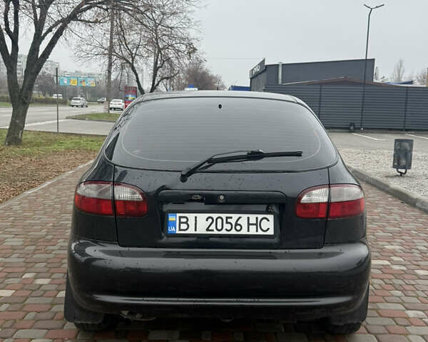 Черный Дэу Ланос, объемом двигателя 1.6 л и пробегом 181 тыс. км за 2350 $, фото 3 на Automoto.ua