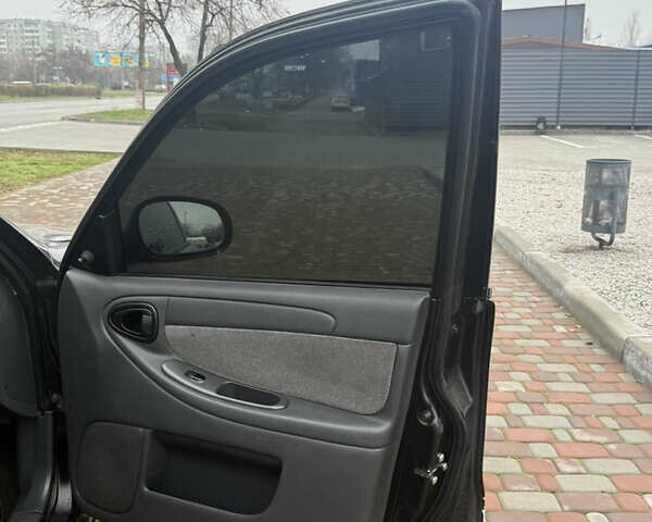 Черный Дэу Ланос, объемом двигателя 1.6 л и пробегом 181 тыс. км за 2350 $, фото 6 на Automoto.ua