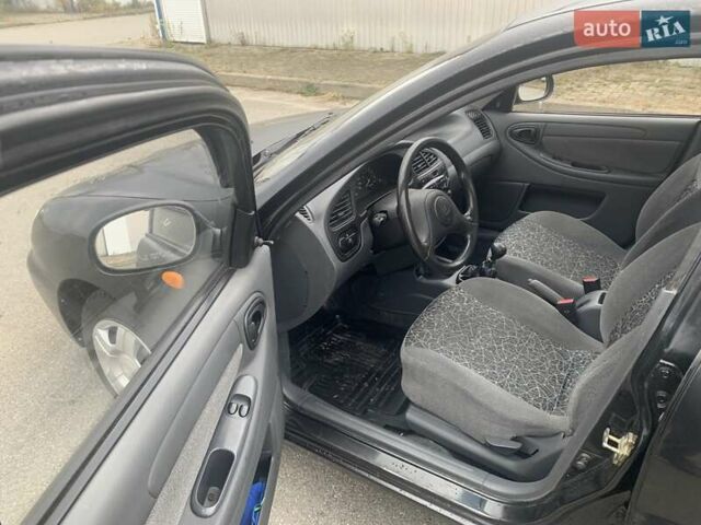 Черный Дэу Ланос, объемом двигателя 1.5 л и пробегом 96 тыс. км за 2900 $, фото 14 на Automoto.ua