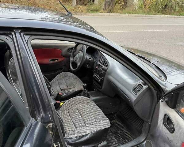 Черный Дэу Ланос, объемом двигателя 1.5 л и пробегом 100 тыс. км за 900 $, фото 16 на Automoto.ua