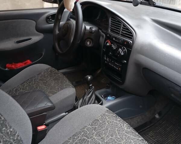 Черный Дэу Ланос, объемом двигателя 1.5 л и пробегом 272 тыс. км за 2000 $, фото 4 на Automoto.ua