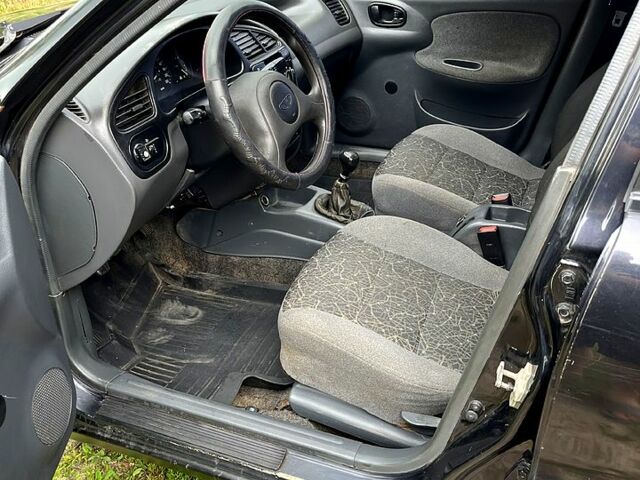 Черный Дэу Ланос, объемом двигателя 1.5 л и пробегом 250 тыс. км за 1400 $, фото 4 на Automoto.ua