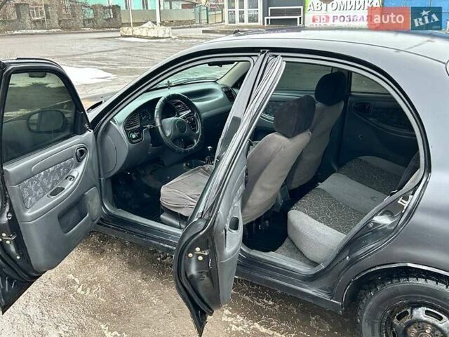 Черный Дэу Ланос, объемом двигателя 1.5 л и пробегом 230 тыс. км за 1650 $, фото 6 на Automoto.ua