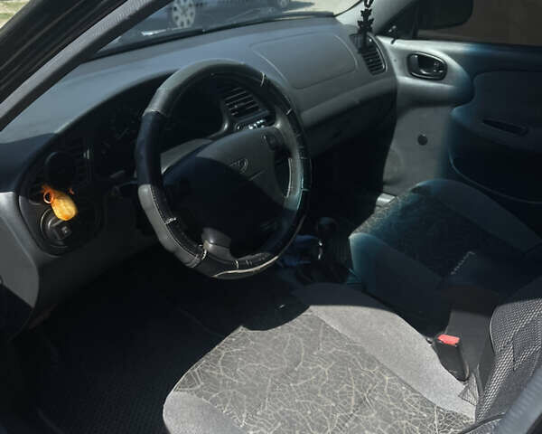Чорний Деу Ланос, об'ємом двигуна 1.5 л та пробігом 123 тис. км за 3300 $, фото 5 на Automoto.ua