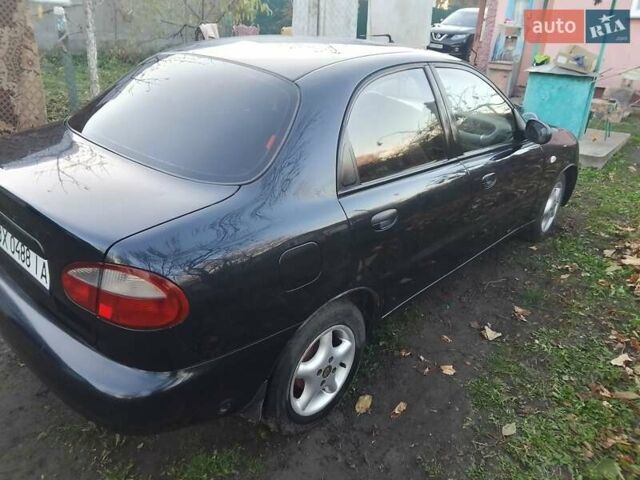 Черный Дэу Ланос, объемом двигателя 1.5 л и пробегом 256 тыс. км за 1850 $, фото 1 на Automoto.ua