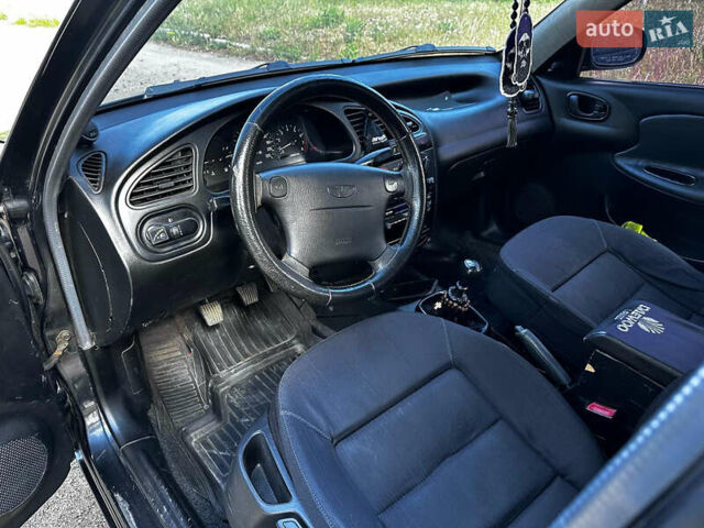 Черный Дэу Ланос, объемом двигателя 1.5 л и пробегом 220 тыс. км за 3100 $, фото 12 на Automoto.ua