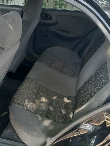 Черный Дэу Ланос, объемом двигателя 1.5 л и пробегом 328 тыс. км за 2700 $, фото 10 на Automoto.ua