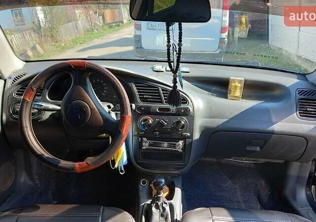 Черный Дэу Ланос, объемом двигателя 1.5 л и пробегом 160 тыс. км за 2300 $, фото 2 на Automoto.ua